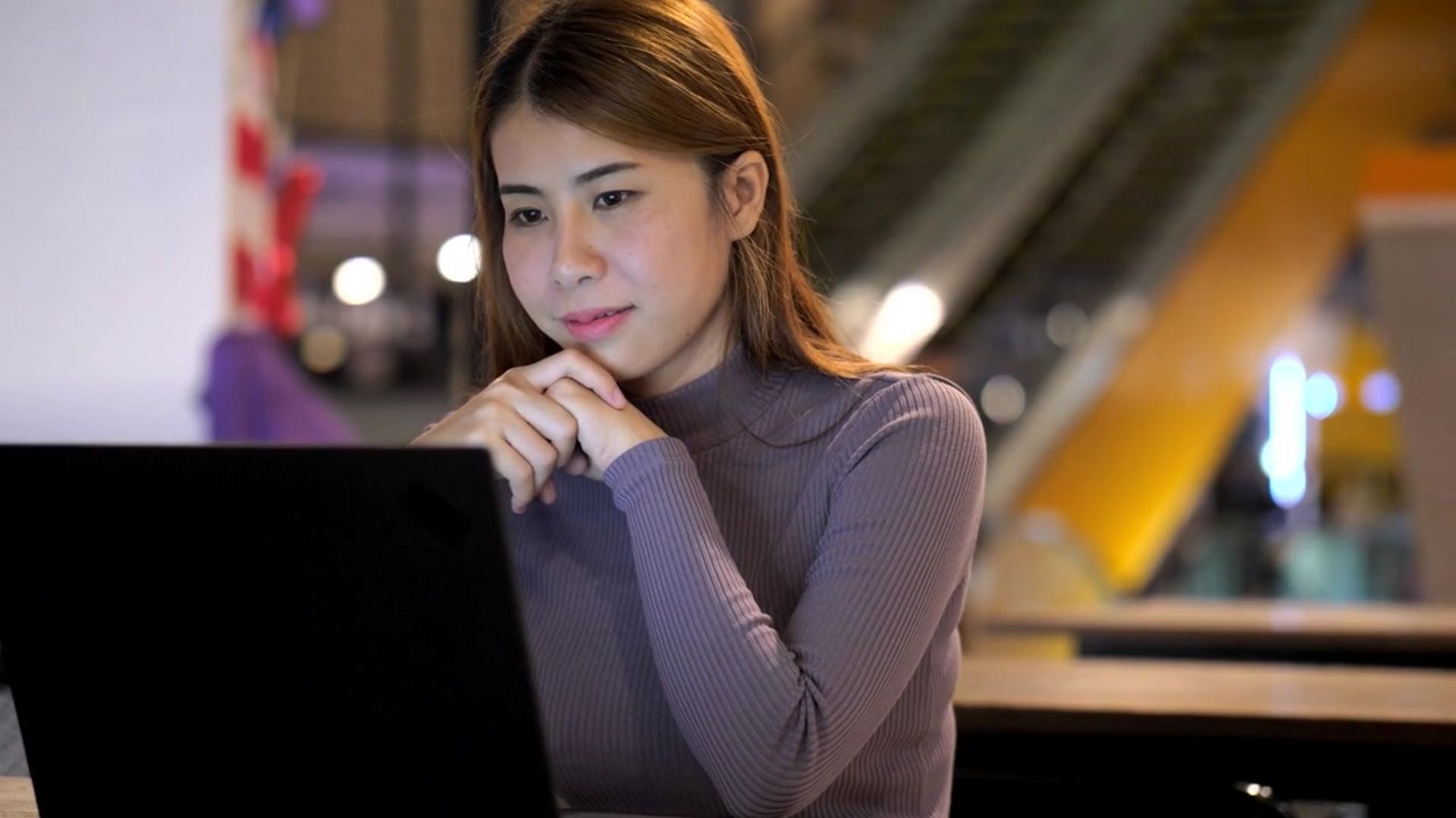 Professional reviewing an online assessment on a computer.